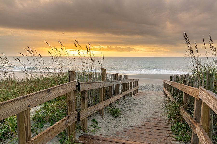 Personal Insurance - Boardwalk Leading to the Beach at Sunrise